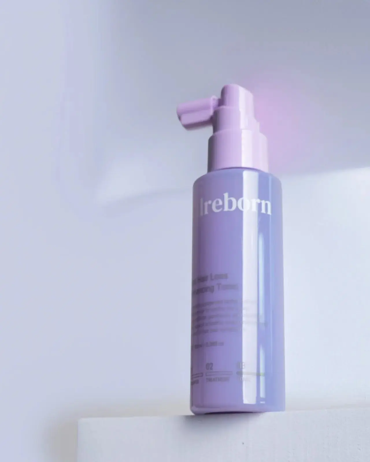 CELLREBORN lavender scalp care packaging (shampoo, treatment and tonic) styled in soft light