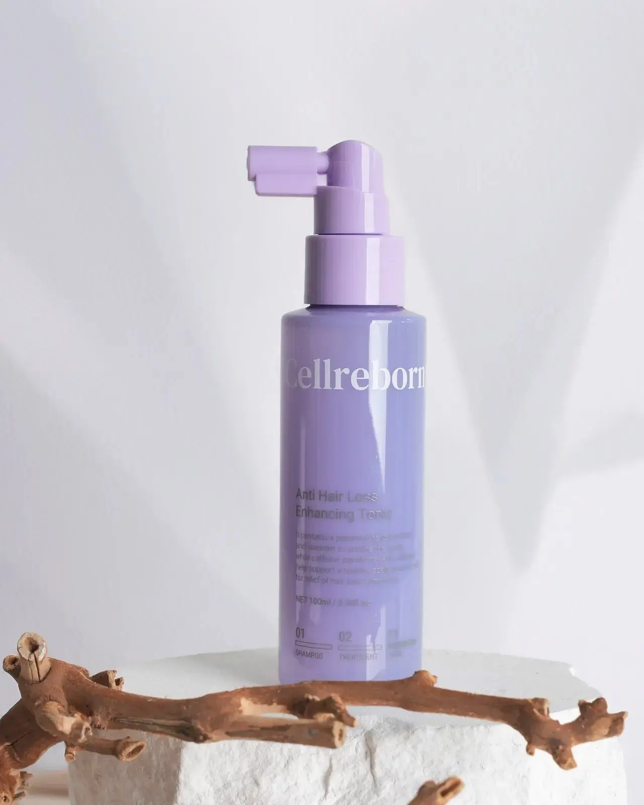 CELLREBORN lavender scalp care packaging (shampoo, treatment and tonic) styled in soft light