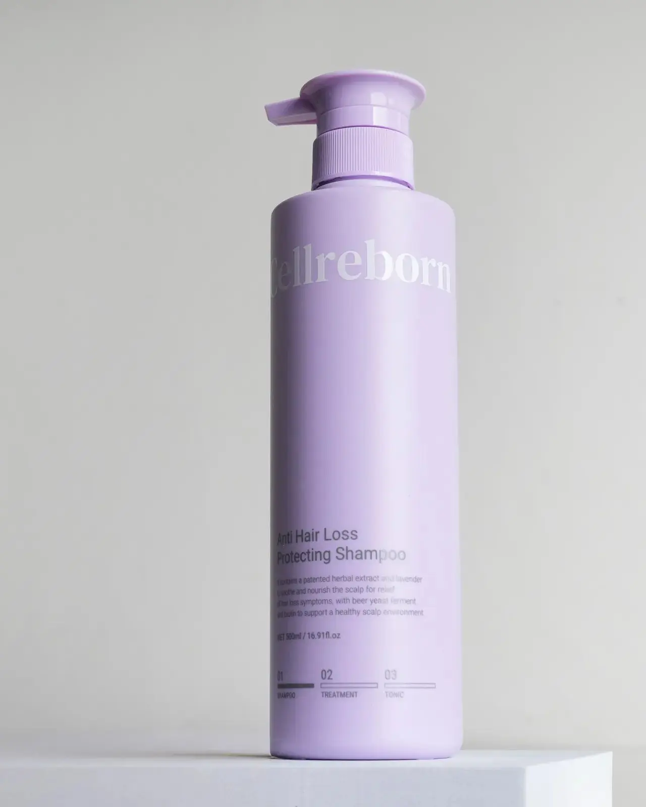 CELLREBORN lavender scalp care packaging (shampoo, treatment and tonic) styled in soft light