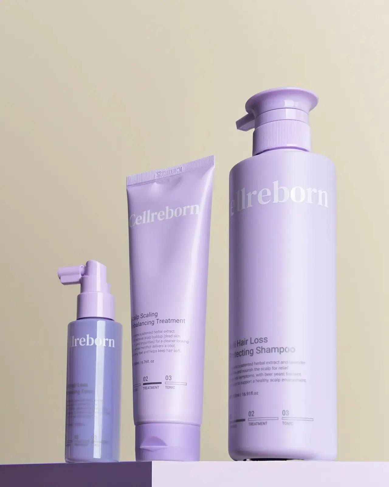 CELLREBORN lavender scalp care packaging (shampoo, treatment and tonic) styled in soft light