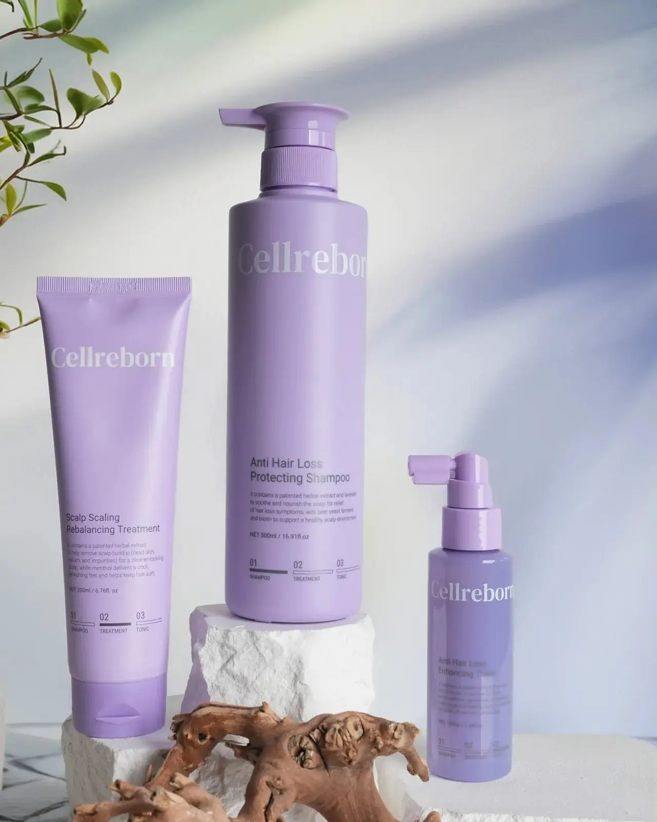 CELLREBORN lavender scalp care packaging (shampoo, treatment and tonic) styled in soft light