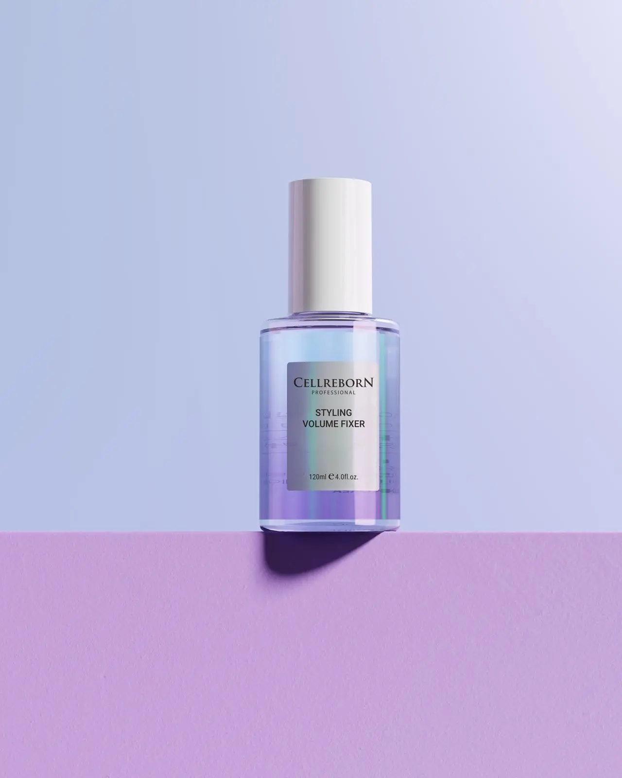 CELLREBORN Athens Styling Volume Fixer bottle on a lilac ledge against a periwinkle backdrop