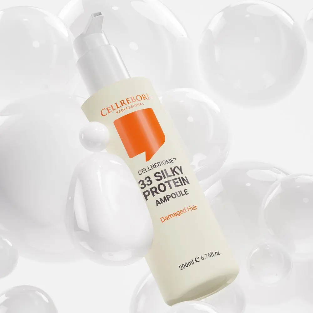 Cellrebiome 33 Silky Protein Ampoule bottle tilted among clear bubbles