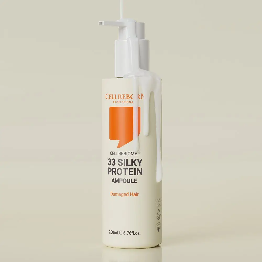 Cellrebiome 33 Silky Protein Ampoule bottle against a pale sage backdrop