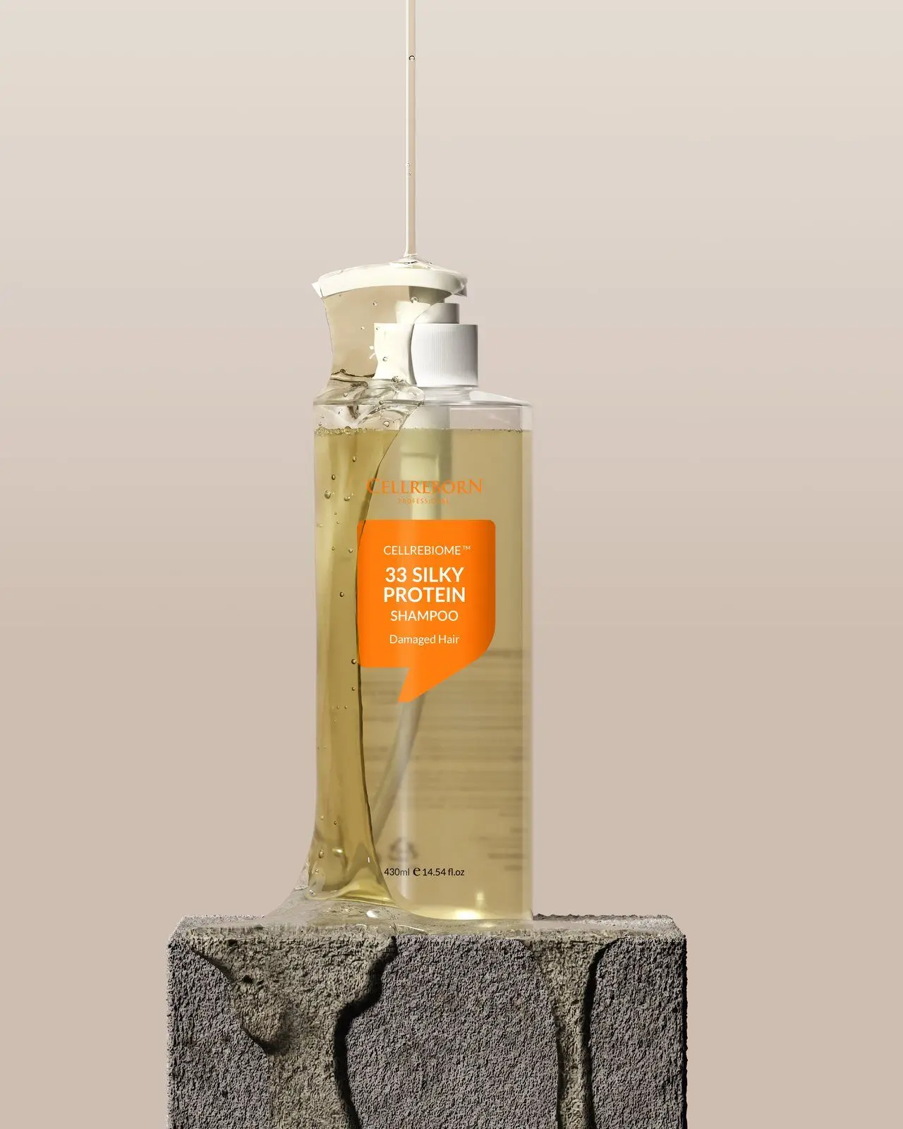 Cellrebiome 33 Silky Protein Shampoo bottle standing on a grey stone pedestal against a warm beige backdrop