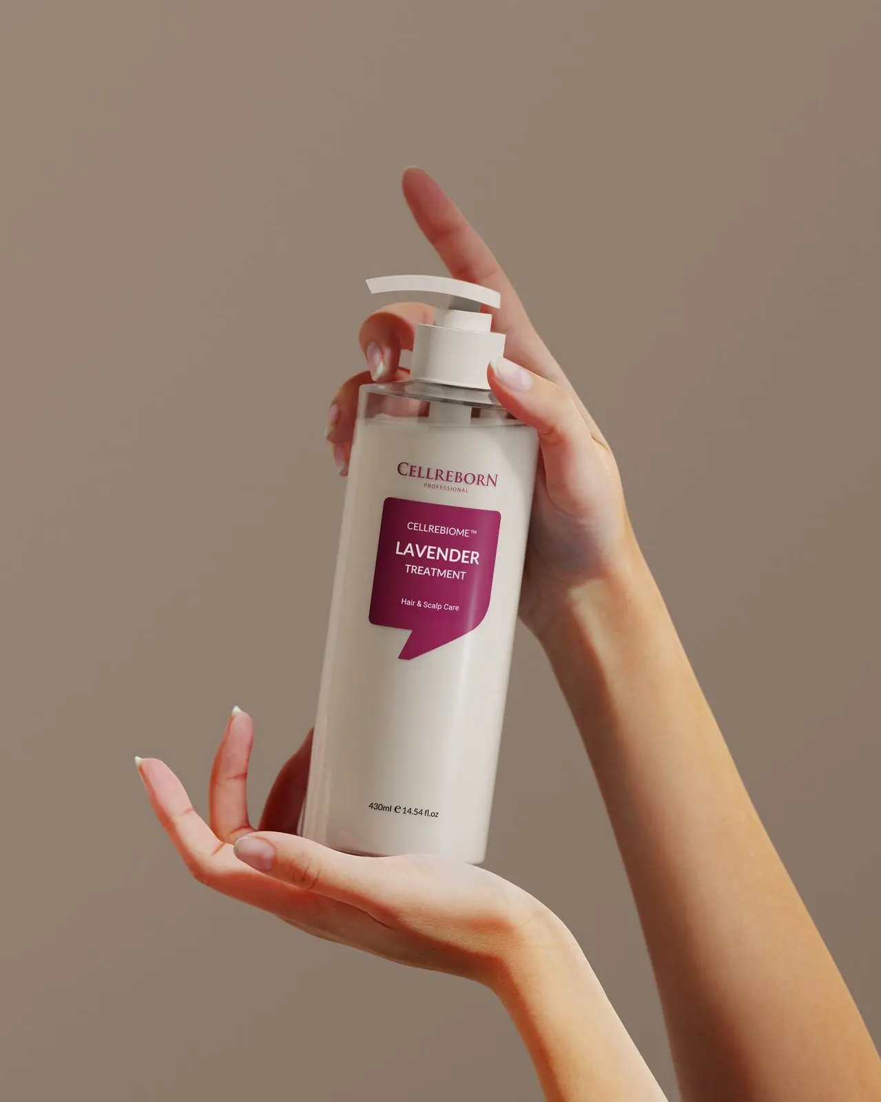 Two hands presenting a Cellrebiome Lavender Treatment bottle against a taupe backdrop