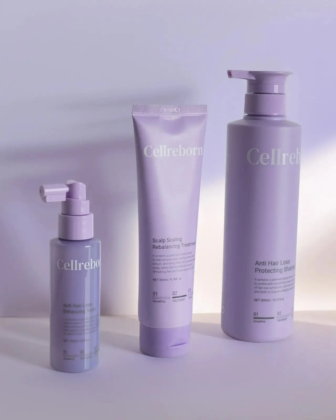 CELLREBORN lavender scalp care packaging (shampoo, treatment and tonic) styled in soft light